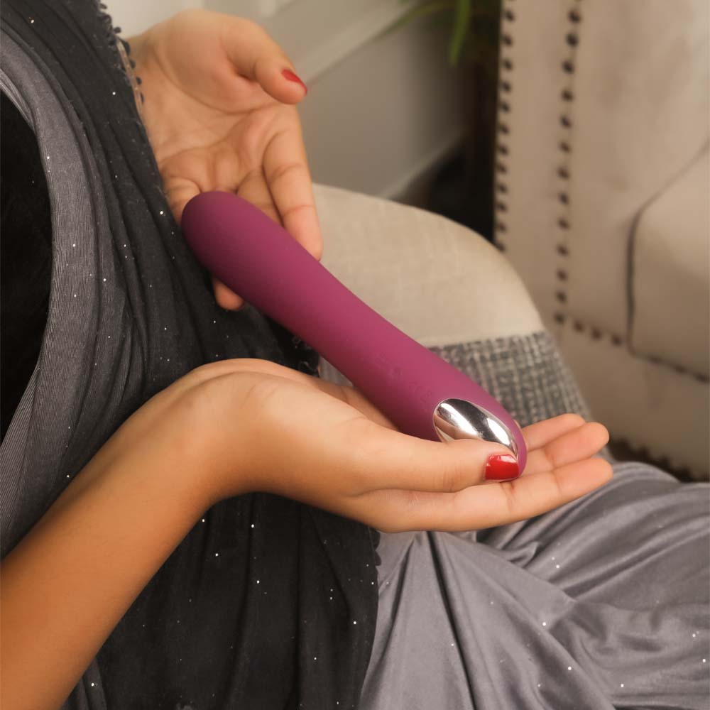 Dual-action rabbit vibrator featuring wand-style handle and flexible bunny ears