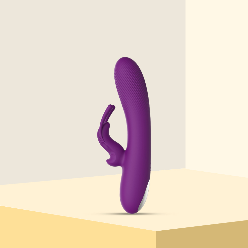 Dual-motor vibrator with ergonomic handle and soft silicone texture