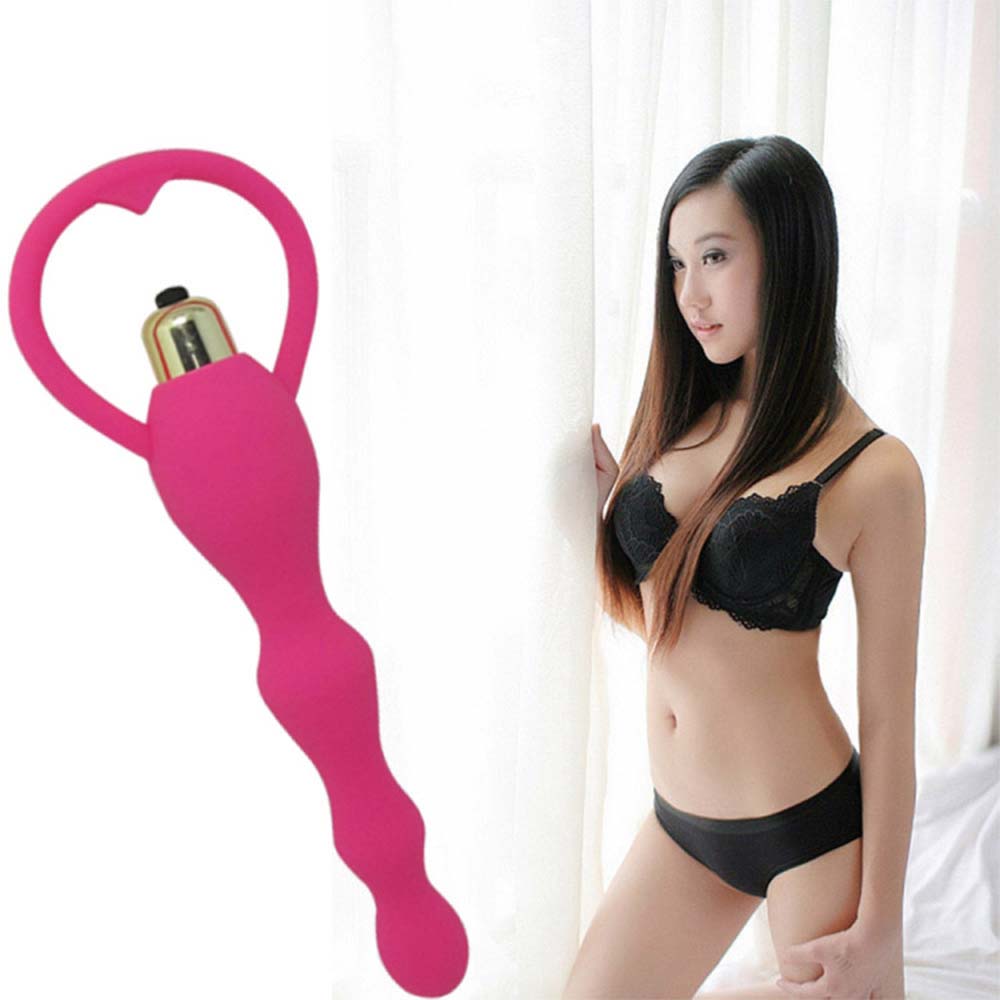 "Beaded silicone massager tool with smooth contours for targeted stimulation."